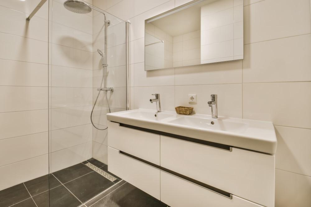 large bathroom with two faucets in vanity